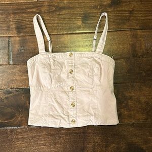 Abercrombie and Fitch adjustable cropped tank top in light pink.